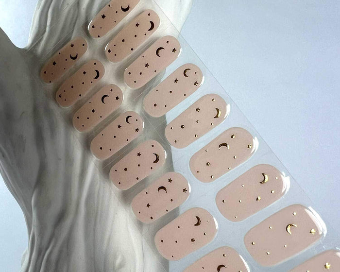 Moon Child semi-cured gel nail wraps on a nail mock-up, close-up