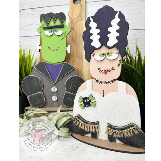 Painted Frankenstein and Bride of Frankenstein wooden Halloween DIY kit bundle displayed together